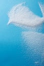 Closeup different shapes of sugar on blue background