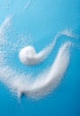 Closeup different shapes of sugar on blue background