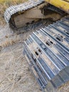 Closeup of the dirty crawler with the dry mud from the paddy field Royalty Free Stock Photo