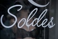 Closeup of discount sign `SOLDES` in french on window Royalty Free Stock Photo