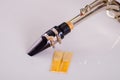 Closeup dismantled mouth piece from saxophone and two reeds lying on white surface Royalty Free Stock Photo