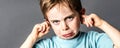 Closeup of displeased little boy with freckles against education problems Royalty Free Stock Photo