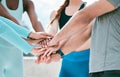 Closeup of diverse group of sporty people stacking hands together in pile to express unity, support and trust. Motivated Royalty Free Stock Photo