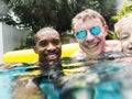 Closeup of diverse people enjoying the pool together