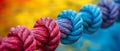 Closeup of diverse team ropes symbolizing strength unity and teamwork against a blurred colorful Royalty Free Stock Photo