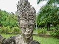 Closeup of a divinity sculpture in Xieng Khuan Buddha Park Laos