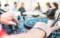 Closeup of dj playing on modern cd usb player at summer beach party - Happy hour and entertainment concept  - Defocused background Royalty Free Stock Photo