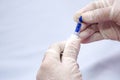 Closeup of doctor hands wear gloves holding syringe for insulin to check blood sugar level and check the health.