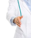 Closeup on doctor stretching hand for handshake Royalty Free Stock Photo
