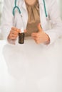 Closeup on doctor woman showing medicine bottle Royalty Free Stock Photo