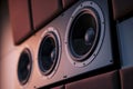 closeup of dolby atmos speakers on theater walls