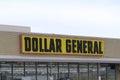 A closeup of a DOLLAR GENERAL advertisement sign on a bright day in Kansas