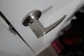 Closeup of door handle -- stainless steel material