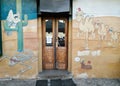 Closeup of a door surrounded by graffiti, restaurant, Berlin
