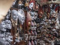 A closeup of the dozens of Venetian colorful traditional Carnaval masks hanged at the wall in a mask shop in Venice, Italy