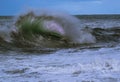 Closeup of a dramatic translucent wave on a rough sea