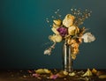 Closeup of dried flowers in the glass vase against the dark green background. Royalty Free Stock Photo