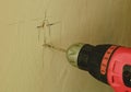 Closeup of drill machine. Drilling hole in the wall. Royalty Free Stock Photo