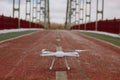 Closeup of drone on the bridge, ready to take off.