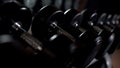 Closeup of dumbbells, strength training equipment in gym, sports accessories Royalty Free Stock Photo