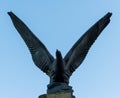 A closeup of an Eagle statue with a blue sky background Royalty Free Stock Photo