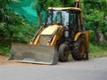 Closeup of an earth mover vehicleJCBparked near the road