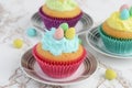 Closeup easter cupcake with blue frosting and mini eggs Royalty Free Stock Photo