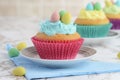 Closeup easter cupcake with mini colorful eggs