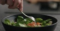 Closeup eating fresh salad with mozzarella and cherry tomatoes with fork