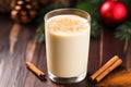 closeup of eggnog in a glass garnished with nutmeg