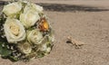 Egyptian desert agama lizard in desert with wedding flower bouquet Royalty Free Stock Photo