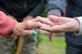 Closeup of elderly couple holding hands. Husband and wife holding hands and comforting each other. Love and care concept Royalty Free Stock Photo