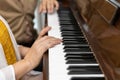 closeup elderly hands playing playing classic piano. classical pianist senior learning