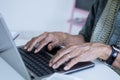 Elderly man hands typing on the laptop Royalty Free Stock Photo