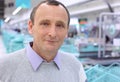 Closeup elderly man in shop with empty counters