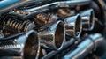 Closeup of an electric blue motorcycle engine with exhaust pipes Royalty Free Stock Photo