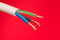 closeup of a electric cable on a red background Royalty Free Stock Photo