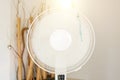 Closeup on electric floor standing fan in action in modern home interior during hot summer day