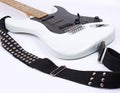 Closeup.electric guitar with metal strap. on white. Royalty Free Stock Photo