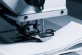 Closeup of the electric household sewing machine and item of clothing Royalty Free Stock Photo