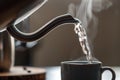 closeup of electric kettles spout pouring hot water into a cup Royalty Free Stock Photo