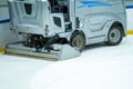 Closeup of an electric operated Ice resurfacer machine cleaning the ice surface