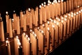 Closeup of electrical illuminated candles in a dark room Royalty Free Stock Photo