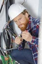 Closeup electrician engineer working on fuse switch box Royalty Free Stock Photo