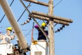 Electricians working on cable car to repair the power line