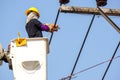 Electricians working on cable car to repair the power line