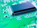 Closeup on electronic computer board. Electronic circuit board with processor microchips and other computer parts Royalty Free Stock Photo