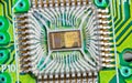 Closeup of electronic integrated circuit die with photodiode array and gold wires on green PCB Royalty Free Stock Photo