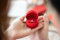 Closeup elegant diamond engagement ring nestled in a classic red velvet box with high quality moment capturing the emotional Royalty Free Stock Photo