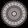 A decorative round doily isolated over black